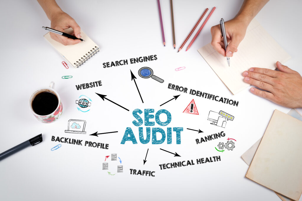 Image of hands writing local seo audit